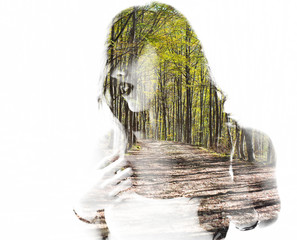 Portrait of a young woman with the effect of double exposure
