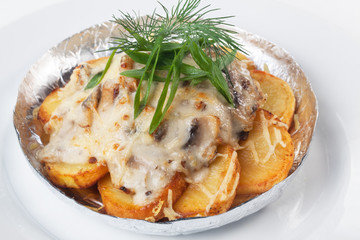 potatoes with mushrooms in foil isolated white background mayonnaise cheese