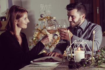 Young couple celebrating Christmas at home