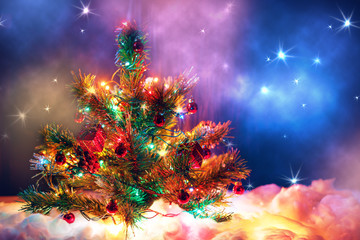 Obraz na płótnie Canvas Christmas tree with garland of lights and decorations.