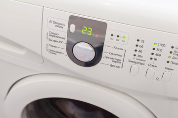 Display washing machine. Macro photo part of modern home washing machine