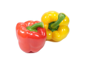 Close-up of two ripe bright color bell peppers, one red and one yellow with green stem isolated on white background 
