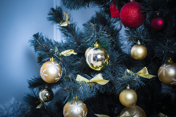 Beautiful background decorated Christmas tree with toy balls and garlands.The idea for postcards. Soft focus. Shallow DOF. blue tones