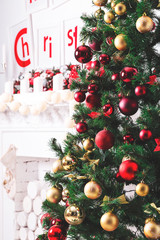 Beautiful new year room with decorated Christmas tree, gifts and fireplace. The idea for postcards. Soft focus. Shallow DOF