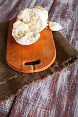 cheese and milk on a wooden board