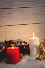 Christmas decorations against wooden wall
