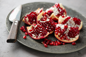 Juicy pomegranates on wood