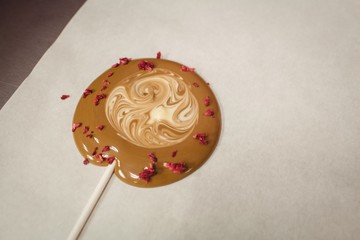 Close-up of lollipop drying on wax paper