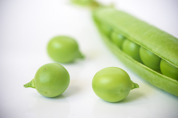 Fresh peas isolated on white background