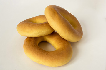 Three donut are a bunch on a white background