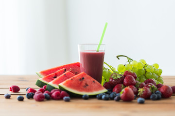 fruit and berry juice or smoothie on wooden  table