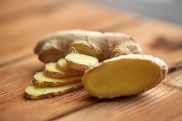 close up of ginger root on wooden table