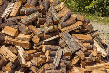 Stack of firewood. Wooden log. Pile of wood logs ready for winter