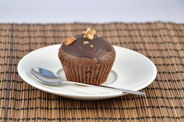 one chocolate brown muffins on white plate best dessert