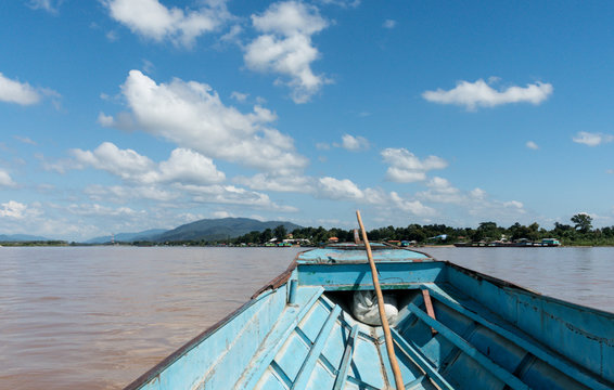 View from boat in Mae Khong river with beautiful sky and sunny d