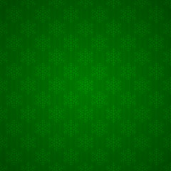 Seamless green background with snowflakes