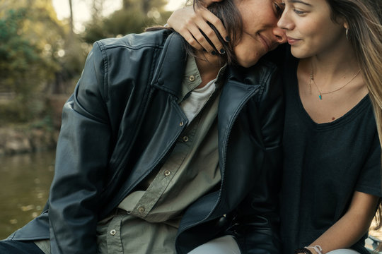 Young couple embracing each other outdoors