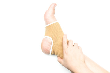 Woman with ankle support, foot injury isolated on white backgrou