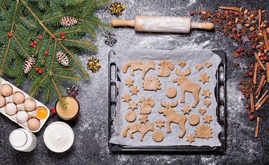 Baking ingredients for Christmas cookies gingerbread. Molds for baking, spices and  decorations for Christmas.