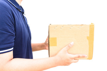 Delivery man in blue uniform holding the box isolated on white b