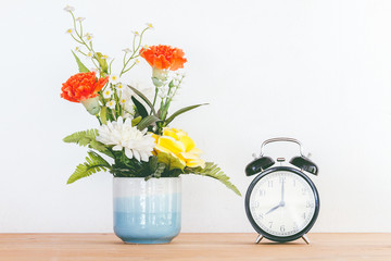 Still life with flowers on wooden table