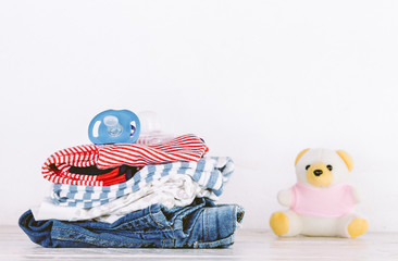 Children clothing on wooden table
