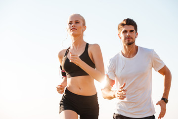 Young couple runners training outdoors