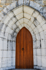 Fototapeta na wymiar Wooden Door and archway of medieval Church 