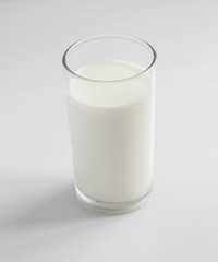 Natural whole milk in a jug and a glass