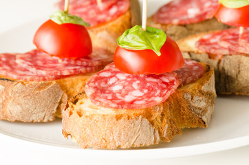 Crostini with salami, tomato and basil, Italian Appetizers