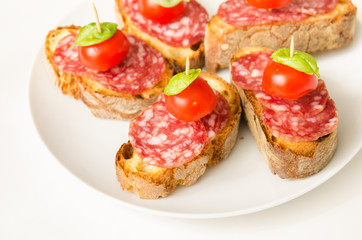Crostini with salami, tomato and basil, Italian Appetizers