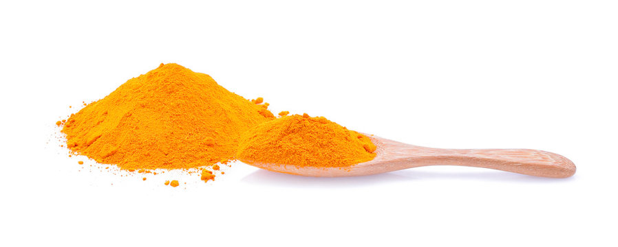 Turmeric, saffron powder, turmeric powder on a wooden spoon isol