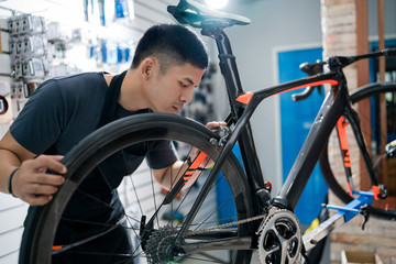 Technicians are repairing bicycles at shop sells