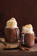 hot chocolate with whipped cream caramel in mason jar