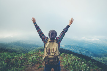 Freedom man standing with raised arms and enjoying on time