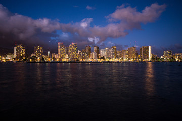 Obraz na płótnie Canvas Skycraper light up at night with waterfront