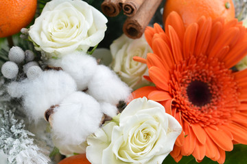 fresh flowers, cinnamon, cotton Christmas composition close-up,