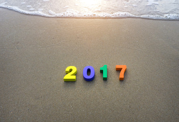 Wooden yellow, violet, green and orange on green grass