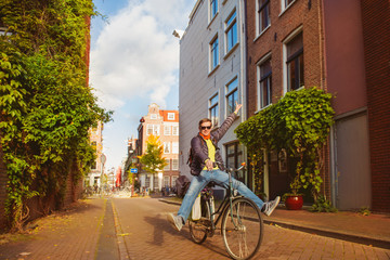 Fototapeta premium Cheerful man on bike