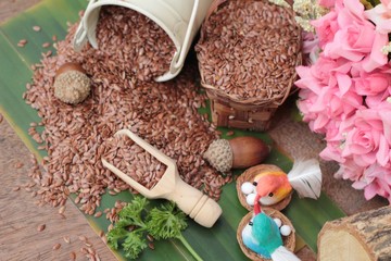 flax seeds for health on wood background.