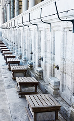 Outside the  Mosque, the seats and taps are used for ablutions  before entering the mosque for prayers.  Istanbul - Turkey 