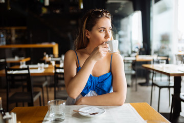 Beautiful woman enjoying her coffee