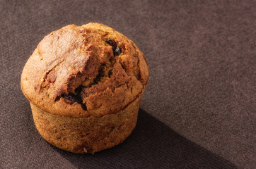 Muffin, fresh home made muffin on brown background
