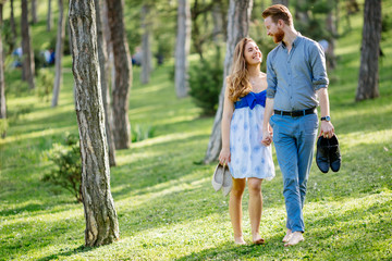 Fototapeta premium Beautiful couple in forest embracing love