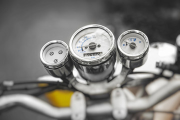 Motorcycle speedometer. Vintage motorbike. Devices on a steering bracket on the old bike.