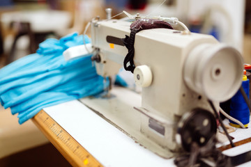 Sewing machine with textile on desk