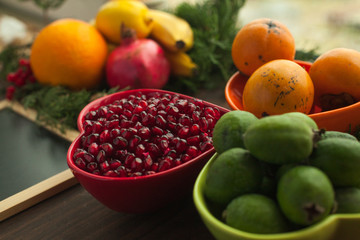 Bowl with purified pomegranate for making juice, healthy meal, ingredient for cooking. Fruit vitamins for healthy life.