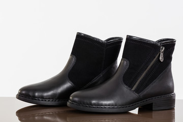 Black  booties on white background