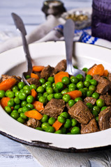 Meat stew with peas and carrots