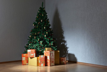Christmas tree with gifts in colourful boxes